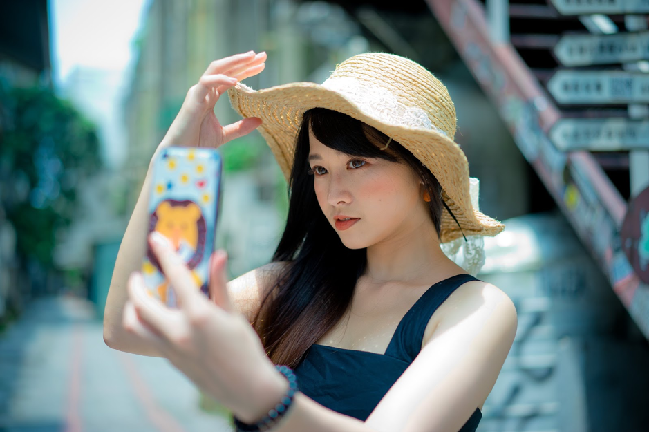 Asian girl taking selfie